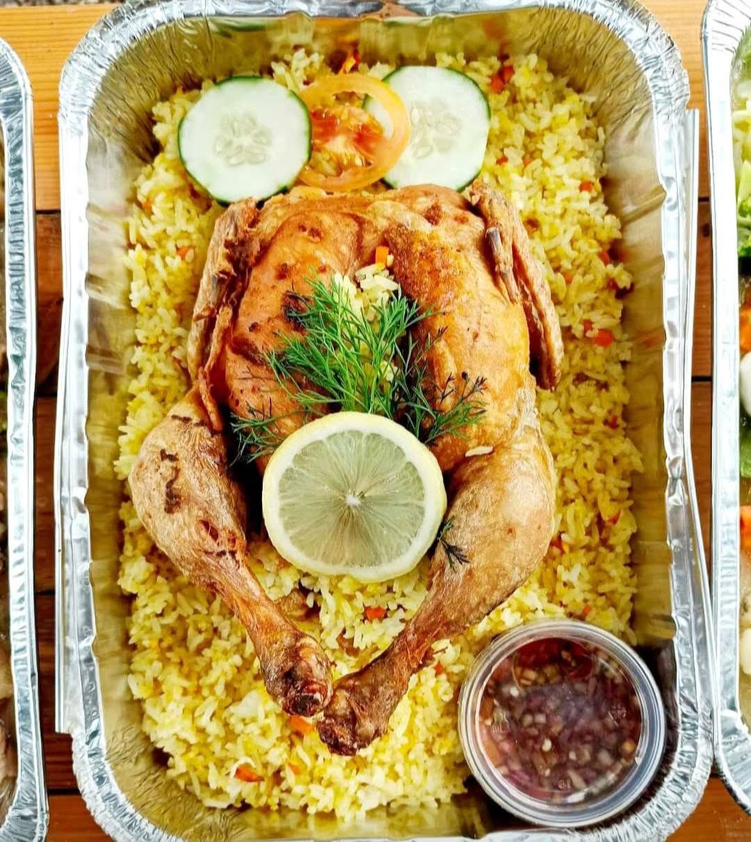 Green Crib's fried chicken served over turmeric rice with salsa, Buenavista, Marinduque